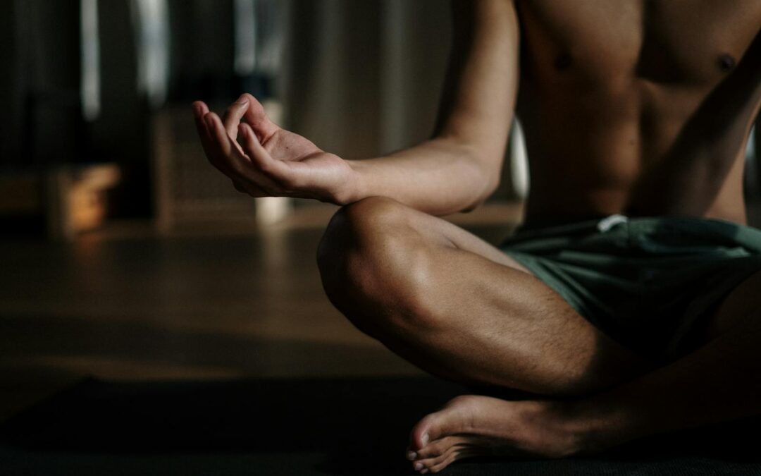 Man in Black Shorts Sitting on Floor